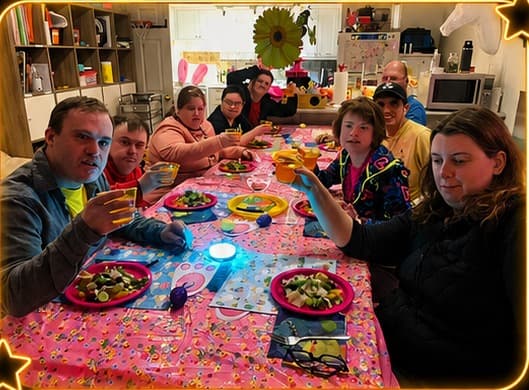 Catching Stars participants sharing a colourful dinner together around a table.