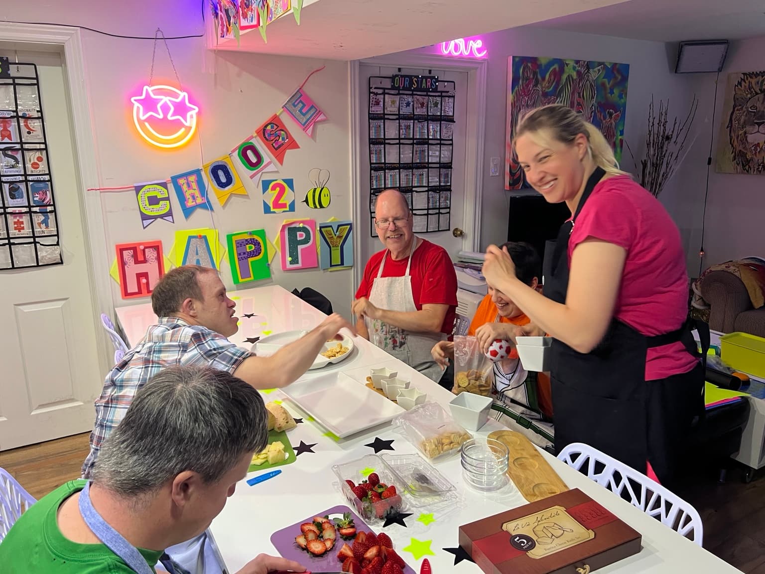 Catching Stars Friends Dinner participants preparing food together in an inclusive adult social program.